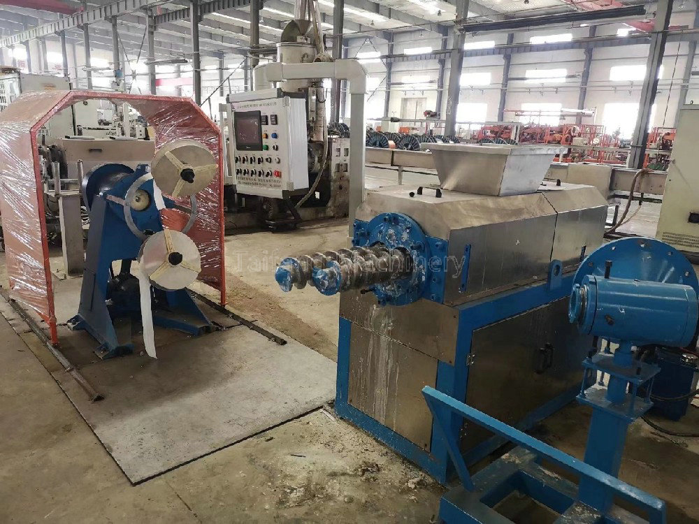 Metal sheath welding and embossing machine
